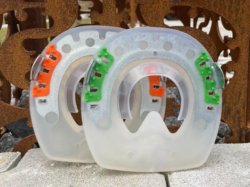 ferro alternativo con inserti verdi e arancioni contro la torsione sullo zoccolo - plastica morbida e dura