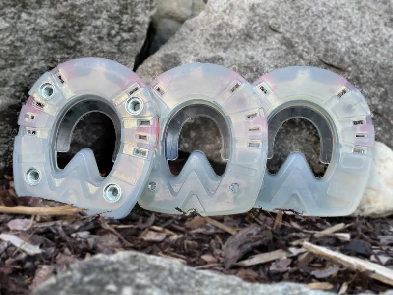 Heavy Duty urethane horseshoe with and without threaded inserts and a heavy duty straight bar shoe with threaded inserts for cleats