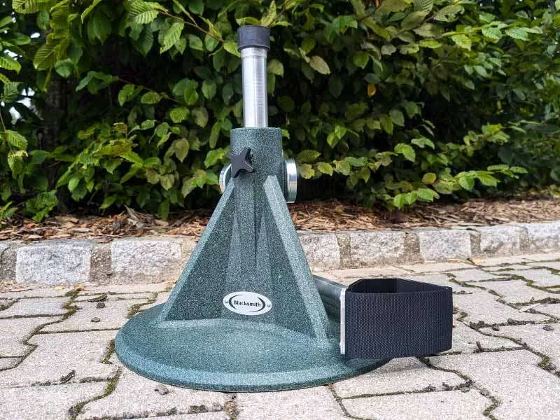 Blacksmith hoof stand with a recycled plastic base and adjustable metal support.