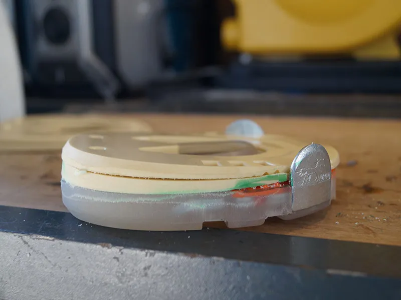 Side view of a wedge horseshoe with wedges made from recycled plastic for adjusting the hoof angle.