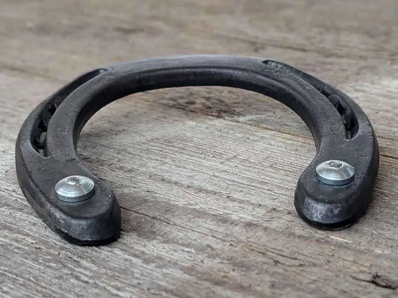 Horseshoe with two drive-in studs, also known as Speedies.
